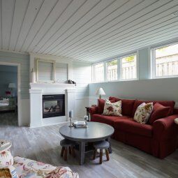 basement rec room with windows