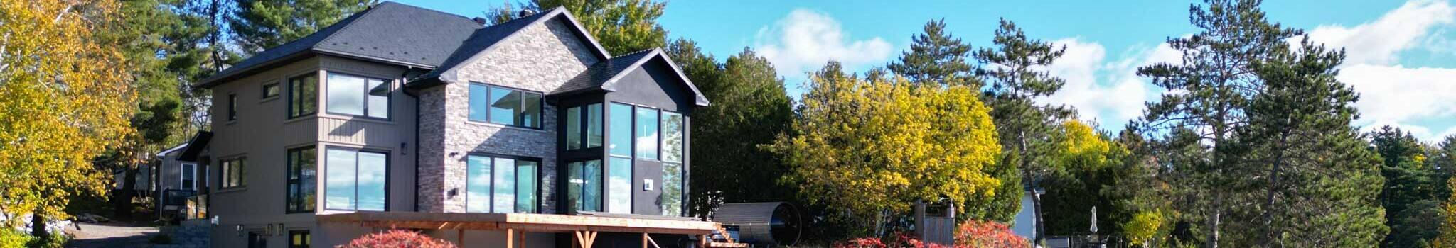 Beautiful back view of a house with our company doors and windows installed.